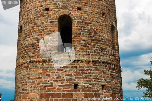 Image of Romanesque cylindrical bell tower of countryside church