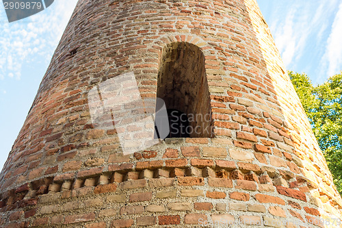 Image of Romanesque cylindrical bell tower of countryside church