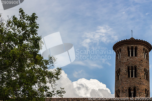 Image of Romanesque cylindrical bell tower of countryside church