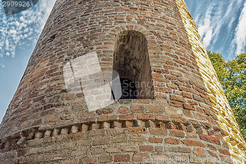 Image of Romanesque cylindrical bell tower of countryside church