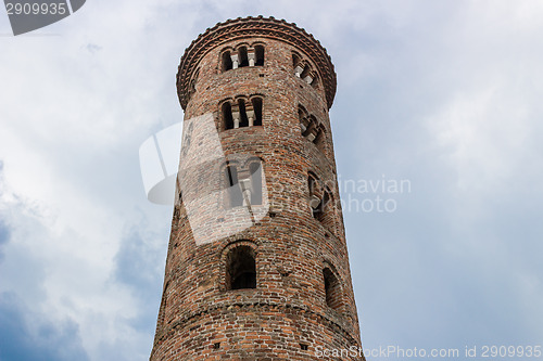 Image of Romanesque cylindrical bell tower of countryside church