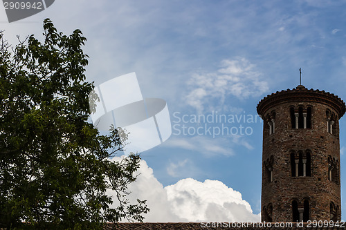 Image of Romanesque cylindrical bell tower of countryside church