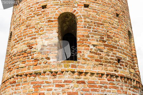 Image of Romanesque cylindrical bell tower of countryside church