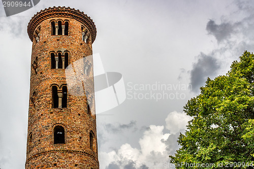 Image of Romanesque cylindrical bell tower of countryside church