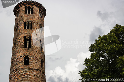 Image of Romanesque cylindrical bell tower of countryside church