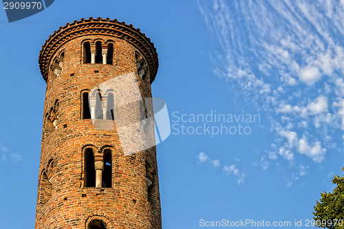 Image of Romanesque cylindrical bell tower of countryside church