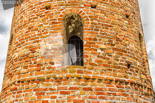 Image of Romanesque cylindrical bell tower of countryside church