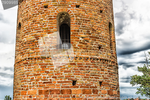 Image of Romanesque cylindrical bell tower of countryside church