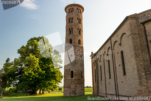 Image of Romanesque cylindrical bell tower of countryside church