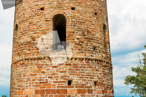 Image of Romanesque cylindrical bell tower of countryside church