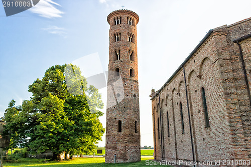 Image of Romanesque cylindrical bell tower of countryside church