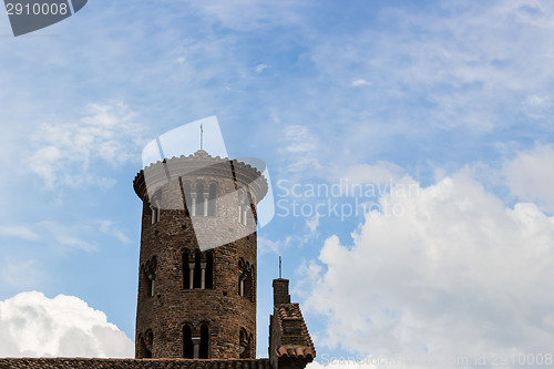 Image of Romanesque cylindrical bell tower of countryside church