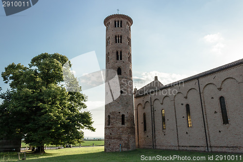 Image of Romanesque cylindrical bell tower of countryside church