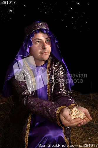 Image of Wiseman bearing gift of frankincense