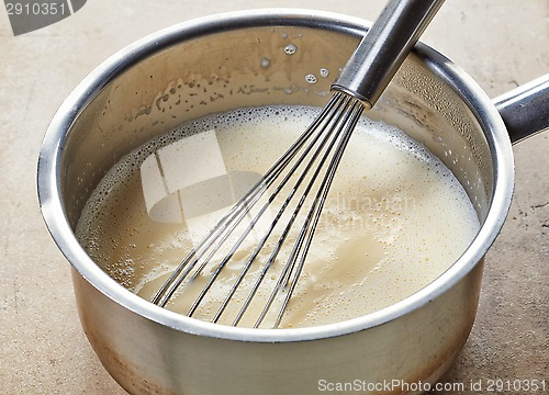 Image of making vanilla sauce in a pot 