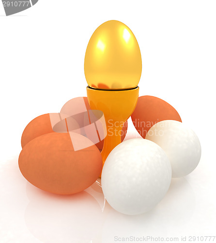 Image of Eggs and gold easter egg on egg cups 