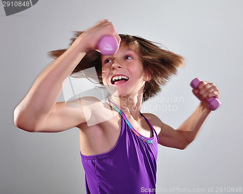 Image of child exercising with dumbells