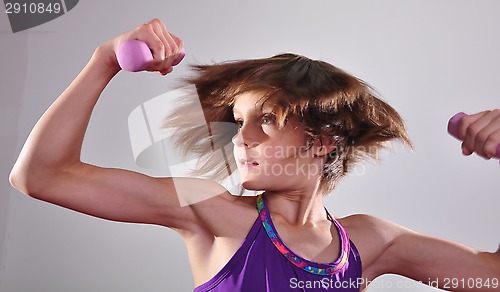 Image of child exercising with dumbells