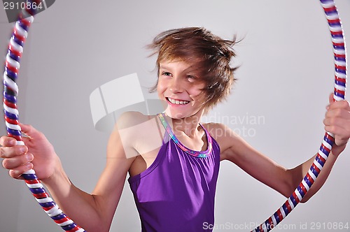 Image of child exercising with a hoop