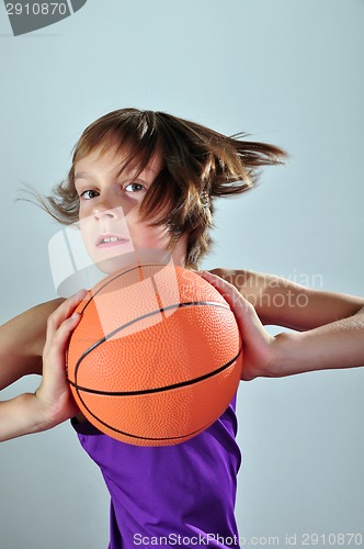 Image of child exercising with ball