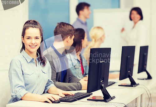 Image of students with computer monitor at school