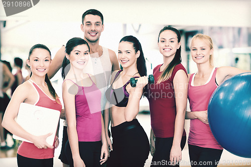 Image of group of smiling people in the gym