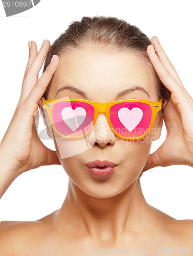 Image of surprised teenage girl in pink sunglasses