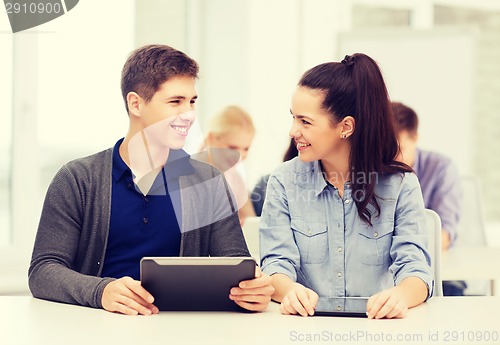 Image of students looking at tablet pc in lecture at school