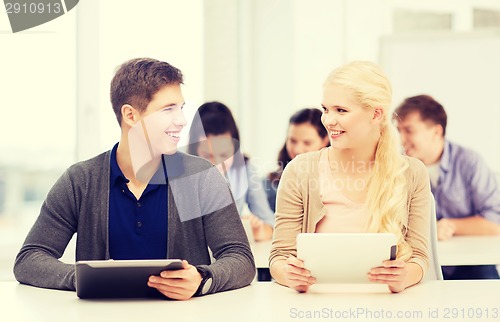 Image of students looking at tablet pc in lecture at school