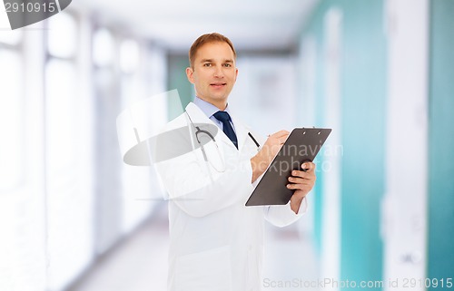 Image of smiling male doctor with clipboard and stethoscope