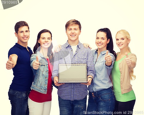 Image of smiling students with laptop computer