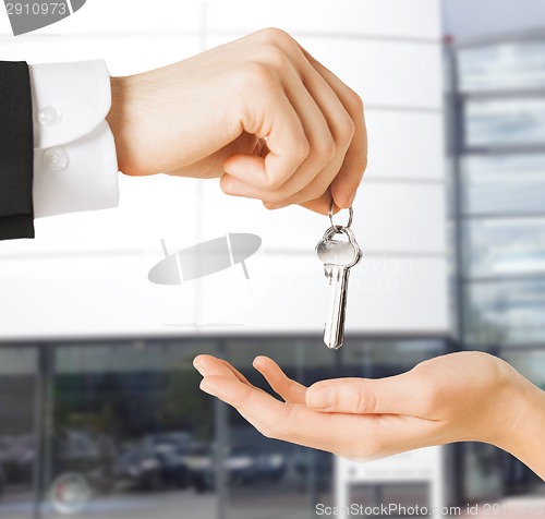 Image of man and woman with house keys