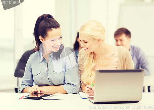 Image of students with laptop, tablet pc and notebooks