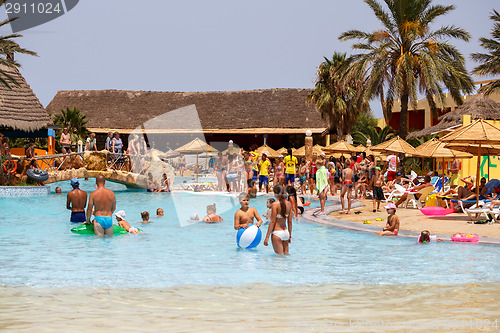 Image of Tourists on holiday in pool, Tunisia