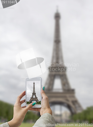 Image of Taken pictures Eiffel Tower with mobile phone