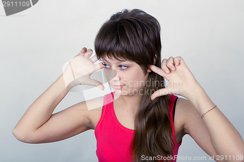Image of young girl stopped up their ears