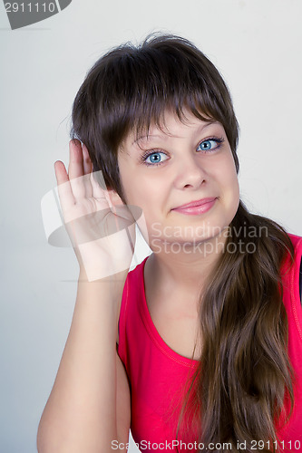 Image of A smiling young girl listening attentively