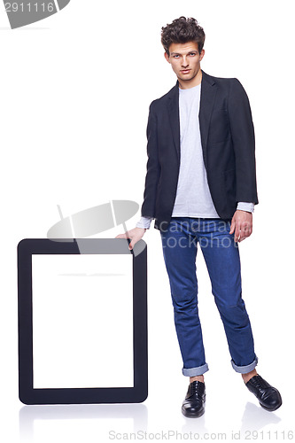 Image of Full length man holding empty frame
