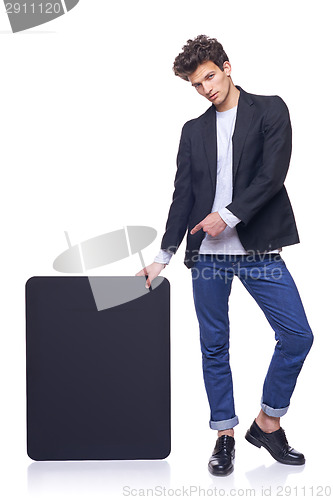 Image of Full length man holding empty frame