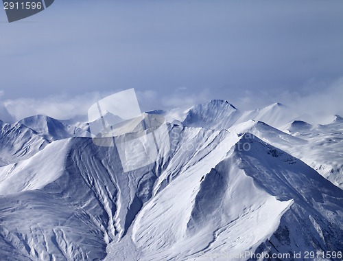 Image of Snowy mountains in mist