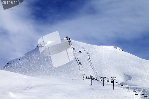 Image of Ski slope and chair-lift at morning