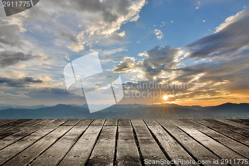 Image of City sunset with wooden ground