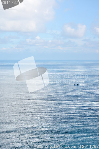 Image of Clouds above a surface of the sea