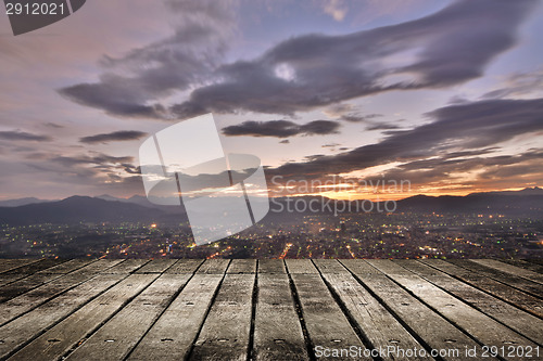 Image of City sunset with wooden ground