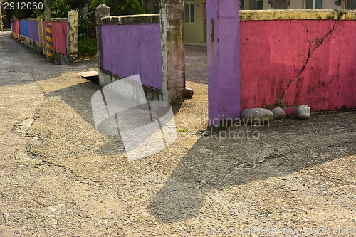 Image of Aged colorful stone fence