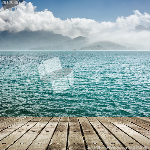 Image of lake with wooden ground