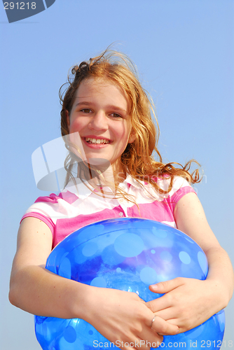 Image of Young girl with beach ball