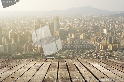Image of City sunset with wooden ground
