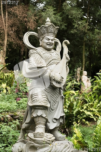 Image of Aged asian god statue