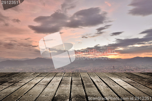 Image of City sunset with wooden ground